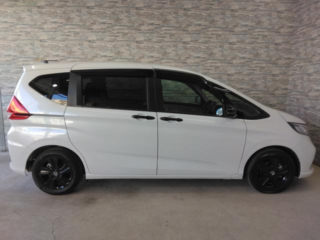 フリードハイブリッド ハイブリッド・Ｇブラックスタイル　２年保証　弊社下取車　６人乗り　９インチナビＴＶ　シートヒーター　ＥＴＣ　両側パワースライドドア（6枚目）