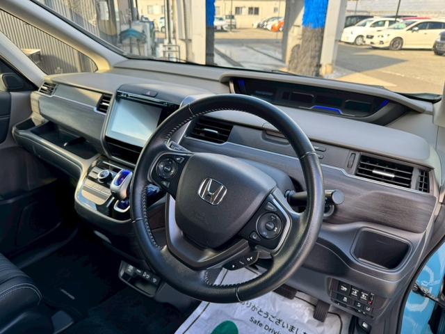 フリードハイブリッド ハイブリッド・Gホンダセンシング グー認定書付/純正ナビ/バックカメラ/衝突軽減ブレーキ/両側電動スライドドア/ETC車載器/レーンアシスト/Bluetooth/フルセグテレビ/スペアスマートキー/プッシュスタート/LEDヘッドライト(35枚目)