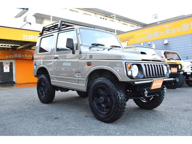 ジムニー ワイルドウインド　リフトアップ　社外マフラー　前後アイアンバンパー　オールペイント　ルーフラック　レザー調シートカバー　ウッドハンドル（3枚目）