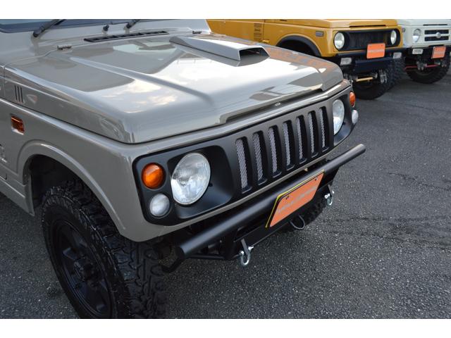 ジムニー ワイルドウインド　リフトアップ　社外マフラー　前後アイアンバンパー　オールペイント　ルーフラック　レザー調シートカバー　ウッドハンドル（12枚目）