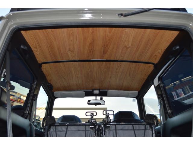 ジムニー ワイルドウインド　リフトアップ　社外マフラー　前後アイアンバンパー　オールペイント　ルーフラック　レザー調シートカバー　ウッドハンドル（29枚目）