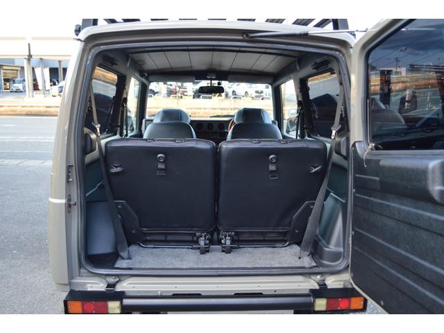 ジムニー ワイルドウインド　リフトアップ　社外マフラー　前後アイアンバンパー　オールペイント　ルーフラック　レザー調シートカバー　ウッドハンドル（30枚目）