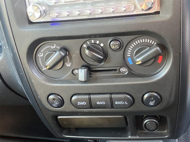ジムニー ワイルドウインド 4WD ETC キーレスエントリー 電動格納ミラー シートヒーター MT ABS CD MD リフトアップ ルーフレール アルミホイール 衝突安全ボディ エアコン パワーウィンドウ(4枚目)