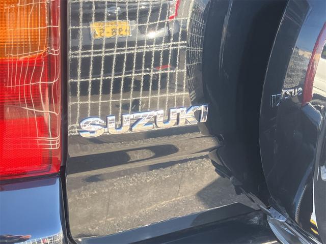 ジムニー ワイルドウインド 4WD ETC キーレスエントリー 電動格納ミラー シートヒーター MT ABS CD MD リフトアップ ルーフレール アルミホイール 衝突安全ボディ エアコン パワーウィンドウ(24枚目)