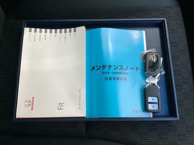 フィット １３Ｇ・Ｆパッケージ　メモリーナビ　ＥＴＣ　イモビ　スマ－トキ－　記録簿有り　ＶＳＡ　助手席エアバッグ　オートエアコン　エアバック　ＰＳ　キ－フリ－　１セグ　ＰＷ　ＡＢＳ　ＴＶナビ　アイドリングＳＴＯＰ（18枚目）