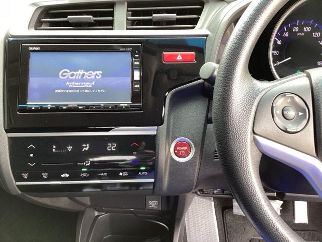 フィットハイブリッド Fパッケージ 純正メモリーナビ ドラレコ リアカメラ 地デジTV 盗難警報装置 記録簿有り AUTOエアコン Dレコ 助手席エアバック ECON ETC付き リヤカメラ ABS付 DVD視聴 横滑り防止システム(3枚目)