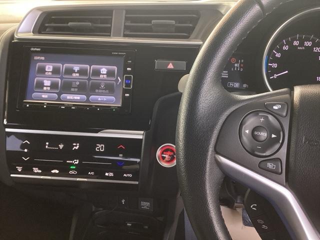 フィットハイブリッド Lホンダセンシング 純正ナビ フルセグ リアカメラ 軽減ブレーキ Rカメ LED サイドSRS 横滑り防止 ドライブレコーダー ナビTV パワーステアリング 盗難防止装置 オートクルーズ ETC車載器 DVD再生 ABS(2枚目)