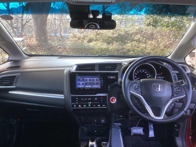 フィットハイブリッド Lホンダセンシング 純正ナビ フルセグ リアカメラ 軽減ブレーキ Rカメ LED サイドSRS 横滑り防止 ドライブレコーダー ナビTV パワーステアリング 盗難防止装置 オートクルーズ ETC車載器 DVD再生 ABS(3枚目)