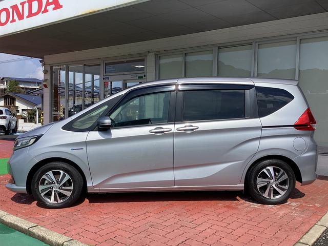 フリードハイブリッド ハイブリッド・Ｇホンダセンシング　Ｈｏｎｄａ　ＳＥＮＳＩＮＧ・純正ナビ・Ｂｌｕｅｔｏｏｔｈ対応・バックカメラ・両側電動スライドドア・シートヒーター・ＥＴＣ（7枚目）