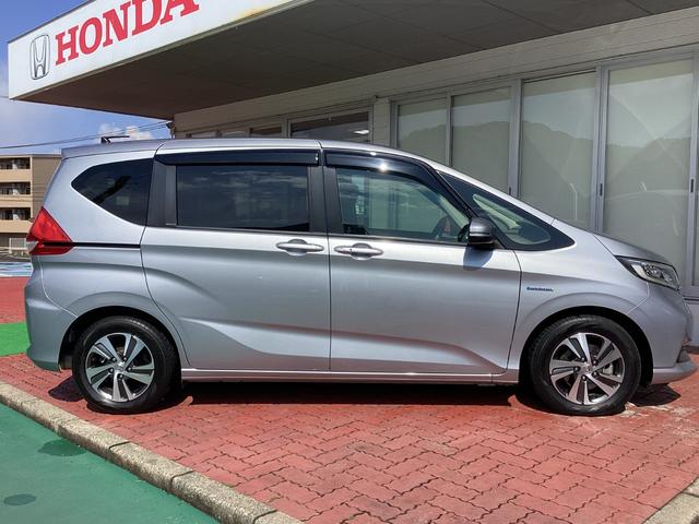 フリードハイブリッド ハイブリッド・Ｇホンダセンシング　Ｈｏｎｄａ　ＳＥＮＳＩＮＧ・純正ナビ・Ｂｌｕｅｔｏｏｔｈ対応・バックカメラ・両側電動スライドドア・シートヒーター・ＥＴＣ（10枚目）
