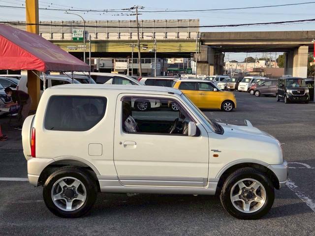 ジムニー ワイルドウインド 後期型 5速ミッション パートタイム4WD タイミングチェーン シートヒーター 革巻きハンドル 背面タイヤ/ハードカバー 電動格納ドアミラー エアコン パワステ パワーウインドウ(9枚目)