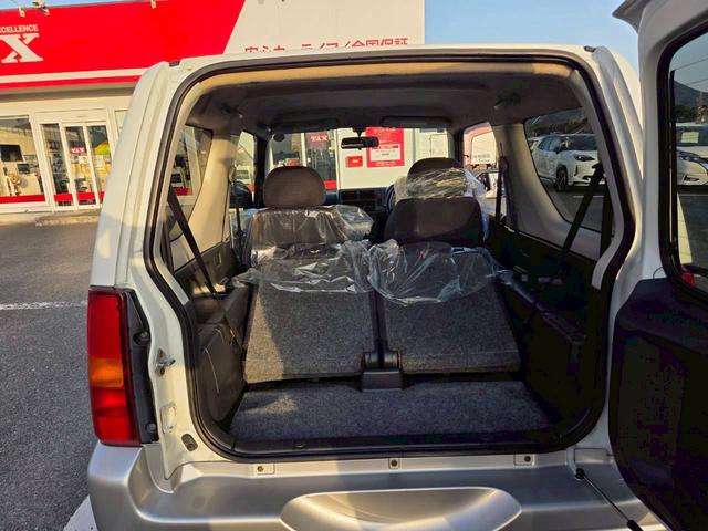 ジムニー ワイルドウインド 後期型 5速ミッション パートタイム4WD タイミングチェーン シートヒーター 革巻きハンドル 背面タイヤ/ハードカバー 電動格納ドアミラー エアコン パワステ パワーウインドウ(23枚目)