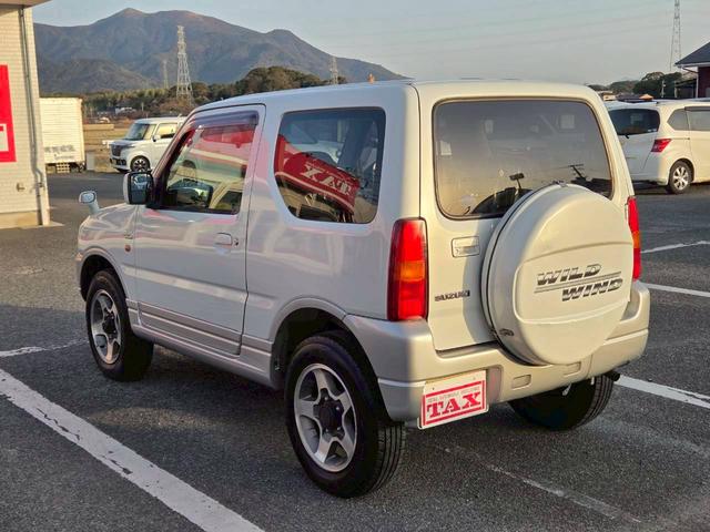 ジムニー ワイルドウインド 後期型 5速ミッション パートタイム4WD タイミングチェーン シートヒーター 革巻きハンドル 背面タイヤ/ハードカバー 電動格納ドアミラー エアコン パワステ パワーウインドウ(25枚目)