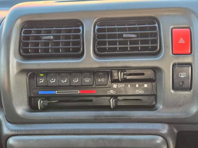 ジムニー ワイルドウインド 後期型 5速ミッション パートタイム4WD タイミングチェーン シートヒーター 革巻きハンドル 背面タイヤ/ハードカバー 電動格納ドアミラー エアコン パワステ パワーウインドウ(26枚目)