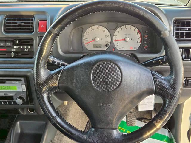 ジムニー ワイルドウインド 後期型 5速ミッション パートタイム4WD タイミングチェーン シートヒーター 革巻きハンドル 背面タイヤ/ハードカバー 電動格納ドアミラー エアコン パワステ パワーウインドウ(48枚目)