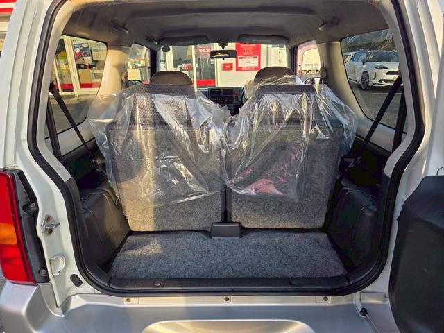 ジムニー ワイルドウインド 後期型 5速ミッション パートタイム4WD タイミングチェーン シートヒーター 革巻きハンドル 背面タイヤ/ハードカバー 電動格納ドアミラー エアコン パワステ パワーウインドウ(49枚目)