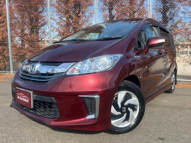 フリードハイブリッド ハイブリッド　プレミアムエディション　６人乗り　両側パワースライドドア　　ＥＴＣ　　スマートキー　　ＨＩＤライト　　ナビ・ＴＶ（ワンセグ）　　バックカメラ　　１年保証（16枚目）