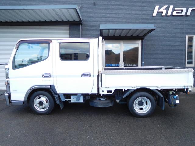 キャンター Ｗキャブロング全低床　Ｗキャブ　カスタムメッキ　メッキ新品バンパーフロントメッキフェンター　後期　新品笠木　６速デュオニック　キーレス　デッキ鉄板張り　オーバーヘッドシェルフ　リヤヒーター　左電動格納ミラー　荷台作業灯（11枚目）