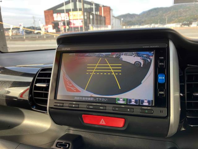 Ｎ－ＢＯＸカスタム Ｇ・Ｌパッケージ　ＥＴＣ　バックカメラ　両側スライド・片側電動　ナビ　ＴＶ　オートライト　ＨＩＤ　スマートキー　電動格納ミラー　ベンチシート　ＣＶＴ　盗難防止システム　ＡＢＳ　ＥＳＣ　ＣＤ　ＤＶＤ再生（4枚目）