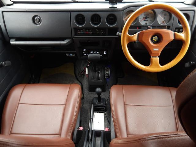 ジムニー ワイルドウインド　純正ルーフキャリア・社外ホイール・社外Ｆバンパーガード・ＣＤオーディオ・ウッドステアリング・皮調シートカバー・ブラックグリル・ＥＴＣ付（5枚目）