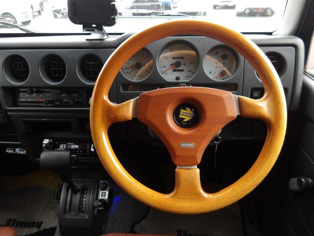 ジムニー ワイルドウインド　純正ルーフキャリア・社外ホイール・社外Ｆバンパーガード・ＣＤオーディオ・ウッドステアリング・皮調シートカバー・ブラックグリル・ＥＴＣ付（17枚目）