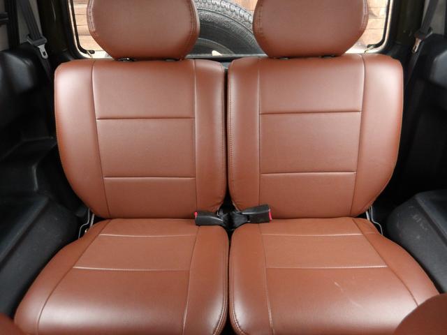 ジムニー ワイルドウインド　純正ルーフキャリア・社外ホイール・社外Ｆバンパーガード・ＣＤオーディオ・ウッドステアリング・皮調シートカバー・ブラックグリル・ＥＴＣ付（19枚目）