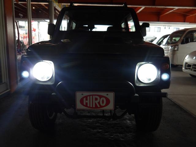 ジムニー ワイルドウインド　純正ルーフキャリア・社外ホイール・社外Ｆバンパーガード・ＣＤオーディオ・ウッドステアリング・皮調シートカバー・ブラックグリル・ＥＴＣ付（20枚目）