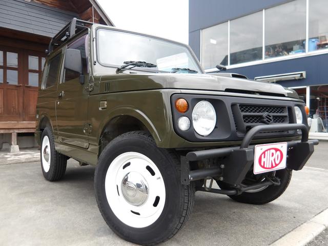 ジムニー ワイルドウインド　純正ルーフキャリア・社外ホイール・社外Ｆバンパーガード・ＣＤオーディオ・ウッドステアリング・皮調シートカバー・ブラックグリル・ＥＴＣ付（26枚目）