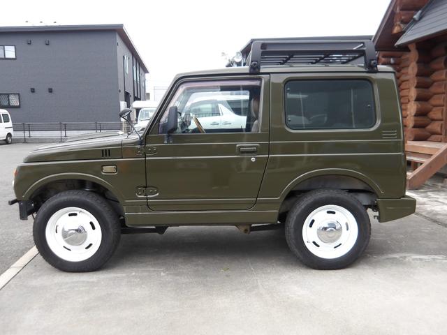 ジムニー ワイルドウインド　純正ルーフキャリア・社外ホイール・社外Ｆバンパーガード・ＣＤオーディオ・ウッドステアリング・皮調シートカバー・ブラックグリル・ＥＴＣ付（27枚目）