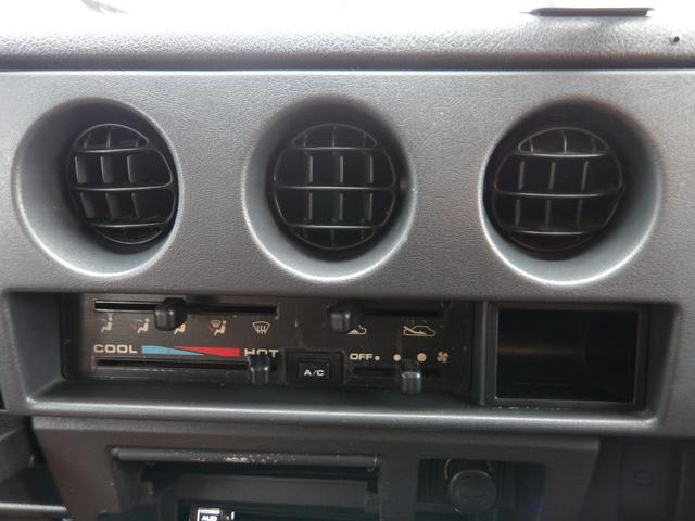 ジムニー ワイルドウインド　純正ルーフキャリア・社外ホイール・社外Ｆバンパーガード・ＣＤオーディオ・ウッドステアリング・皮調シートカバー・ブラックグリル・ＥＴＣ付（33枚目）