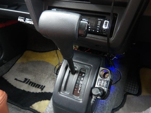 ジムニー ワイルドウインド　純正ルーフキャリア・社外ホイール・社外Ｆバンパーガード・ＣＤオーディオ・ウッドステアリング・皮調シートカバー・ブラックグリル・ＥＴＣ付（34枚目）