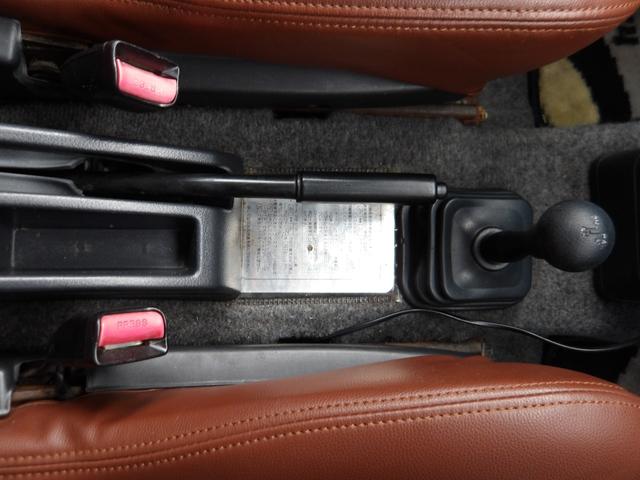 ジムニー ワイルドウインド　純正ルーフキャリア・社外ホイール・社外Ｆバンパーガード・ＣＤオーディオ・ウッドステアリング・皮調シートカバー・ブラックグリル・ＥＴＣ付（35枚目）