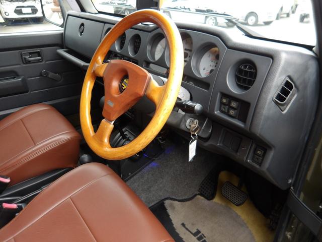 ジムニー ワイルドウインド　純正ルーフキャリア・社外ホイール・社外Ｆバンパーガード・ＣＤオーディオ・ウッドステアリング・皮調シートカバー・ブラックグリル・ＥＴＣ付（42枚目）