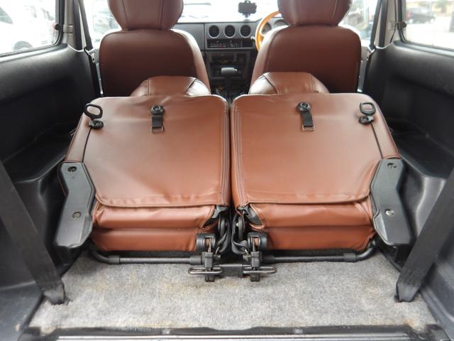 ジムニー ワイルドウインド　純正ルーフキャリア・社外ホイール・社外Ｆバンパーガード・ＣＤオーディオ・ウッドステアリング・皮調シートカバー・ブラックグリル・ＥＴＣ付（57枚目）