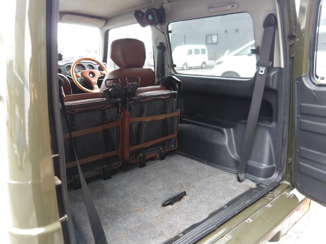 ジムニー ワイルドウインド　純正ルーフキャリア・社外ホイール・社外Ｆバンパーガード・ＣＤオーディオ・ウッドステアリング・皮調シートカバー・ブラックグリル・ＥＴＣ付（59枚目）