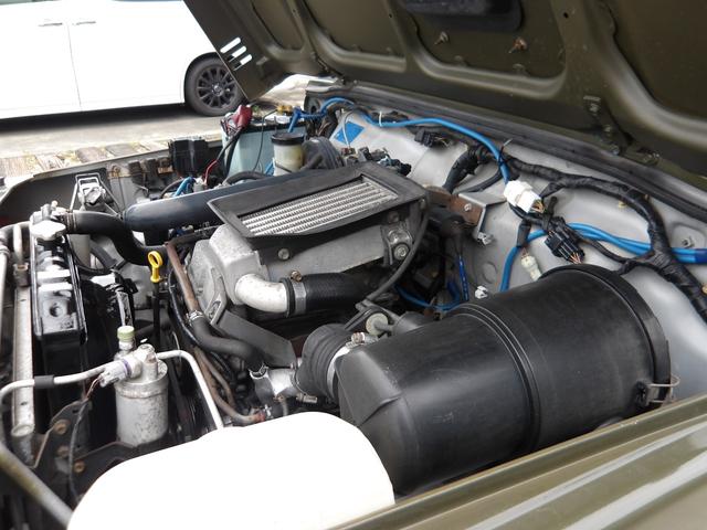 ジムニー ワイルドウインド　純正ルーフキャリア・社外ホイール・社外Ｆバンパーガード・ＣＤオーディオ・ウッドステアリング・皮調シートカバー・ブラックグリル・ＥＴＣ付（64枚目）