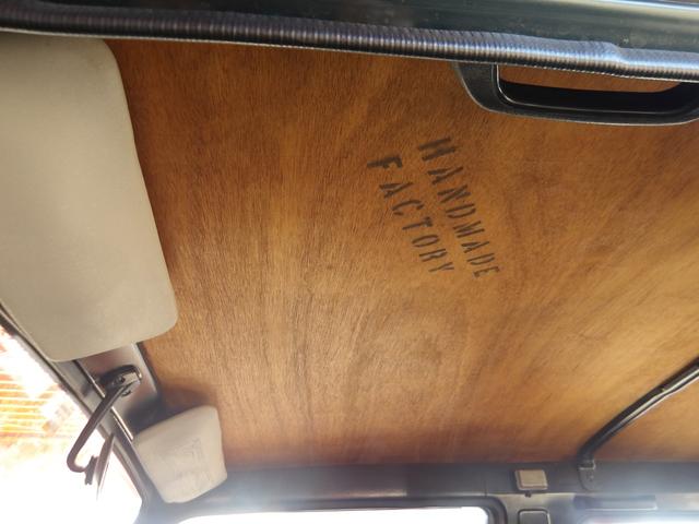 ジムニー ワイルドウインドリミテッド　リフトアップ公認・社外Ｆ＆Ｒバンパー・純正メッキグリル・純正ルーフキャリア・赤ステッチレザーシートカバー・タニグチ製ステップバー・社外ステアリング・純正１６インチＡＷ・Ｍ／Ｔタイヤ・天井ウッド張替（48枚目）