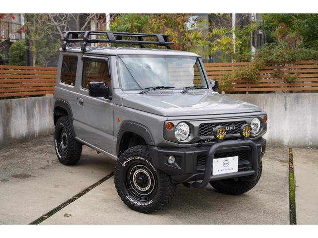 ジムニー ＸＧ　リフトアップ　ショウワガレージガンフィールドＡＷ　ブロックタイヤ　オーバーフェンダー　ルーフキャリア　リヤラダー　シートカバー　オプショングリル　禁煙車　スマートキー　ドラレコ　社外ナビ（3枚目）