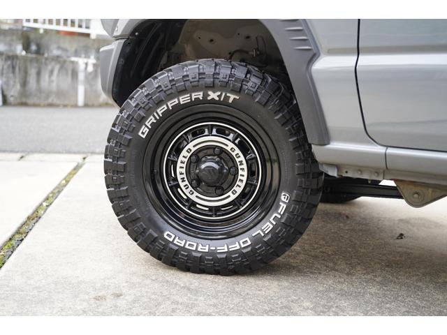 ジムニー ＸＧ　リフトアップ　ショウワガレージガンフィールドＡＷ　ブロックタイヤ　オーバーフェンダー　ルーフキャリア　リヤラダー　シートカバー　オプショングリル　禁煙車　スマートキー　ドラレコ　社外ナビ（10枚目）