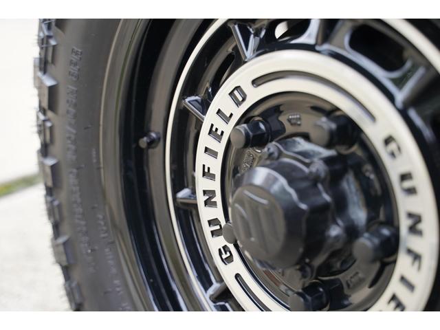 ジムニー ＸＧ　リフトアップ　ショウワガレージガンフィールドＡＷ　ブロックタイヤ　オーバーフェンダー　ルーフキャリア　リヤラダー　シートカバー　オプショングリル　禁煙車　スマートキー　ドラレコ　社外ナビ（11枚目）