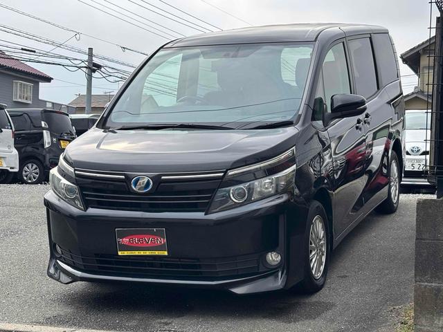 ヴォクシー ハイブリッドＶ　ワンオーナー　ＥＴＣ　バックカメラ　ナビ　ＴＶ　オートクルーズコントロール　両側スライド・片側電動　オートライト　ＬＥＤヘッドランプ　スマートキー　電動格納ミラー　シートヒーター　３列シート　ＣＶＴ（12枚目）