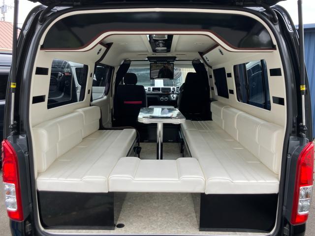 ハイエースワゴン ＧＬ　ロング　ミドルルーフ　キャンピング　ナビテレビ　バックカメラ　後席フリップダウンモニター　ＥＴＣ　キーレス　片側パワースライドドア　社外アルミホイール　サブバッテリー　ベッド　テーブル（7枚目）
