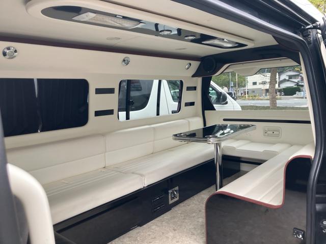 ハイエースワゴン ＧＬ　ロング　ミドルルーフ　キャンピング　ナビテレビ　バックカメラ　後席フリップダウンモニター　ＥＴＣ　キーレス　片側パワースライドドア　社外アルミホイール　サブバッテリー　ベッド　テーブル（8枚目）