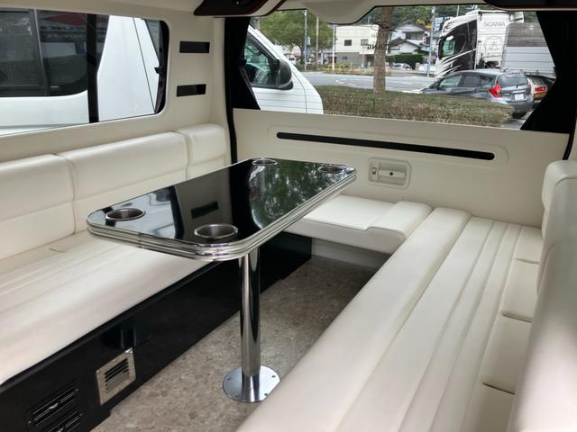 ハイエースワゴン ＧＬ　ロング　ミドルルーフ　キャンピング　ナビテレビ　バックカメラ　後席フリップダウンモニター　ＥＴＣ　キーレス　片側パワースライドドア　社外アルミホイール　サブバッテリー　ベッド　テーブル（10枚目）