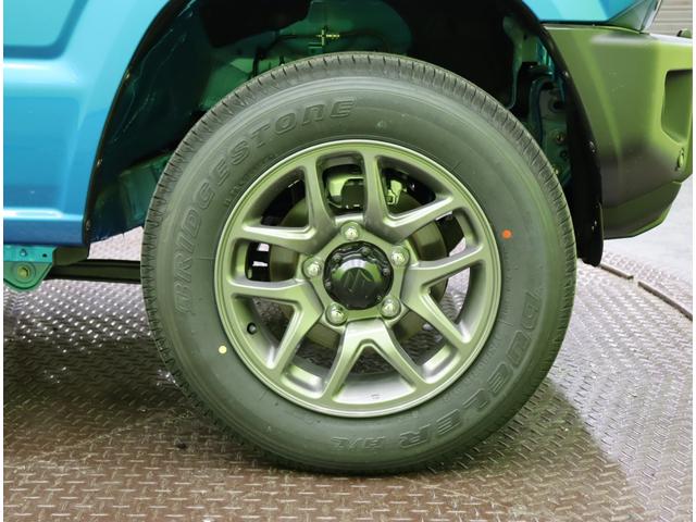 ジムニー ＸＣ／登録済未使用車／　デュアルセンサーブレーキサポート／アダプティブクルコン／シートヒーター／スマートキー／革巻ステア／ハイビームアシスト／ＬＥＤライト／背面タイヤ／Ｆ＆Ｒソナー／１６ＡＷ／５ＭＴ（56枚目）