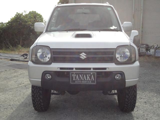 ジムニー ＸＣ　インタークーラーターボ　５速ミッション　４ＷＤ　リフトアップ　純正アルミ　社外マフラー　ナビ　テレビ　サイドシルガード（3枚目）