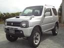 ジムニー ＸＣ　インタークーラーターボ　５速ミッション　４ＷＤ　リフトアップ　純正アルミ　社外マフラー　ナビ　テレビ　サイドシルガード（4枚目）