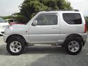 ジムニー ＸＣ　インタークーラーターボ　５速ミッション　４ＷＤ　リフトアップ　純正アルミ　社外マフラー　ナビ　テレビ　サイドシルガード（5枚目）