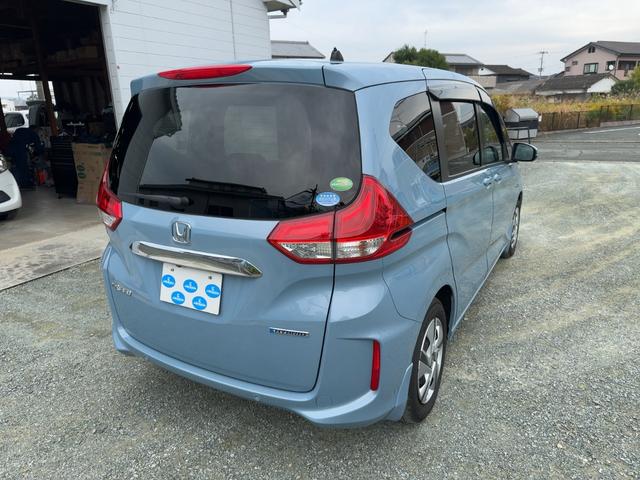 フリードハイブリッド ハイブリッド・Ｇホンダセンシング　キーフリー　プッシュスタート　純正ナビ　フルセグテレビ　ＣＤＤＶＤ再生　ブルートゥースオーディオ　ＥＴＣ　バックカメラ　シートヒーター　両側パワースライドドア　ＬＥＤヘッドライト（2枚目）