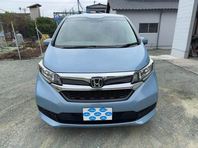 フリードハイブリッド ハイブリッド・Ｇホンダセンシング　キーフリー　プッシュスタート　純正ナビ　フルセグテレビ　ＣＤＤＶＤ再生　ブルートゥースオーディオ　ＥＴＣ　バックカメラ　シートヒーター　両側パワースライドドア　ＬＥＤヘッドライト（5枚目）